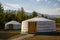 Yurt camp on a beautiful sunny day in Mongolia. Ger campsite in rural country, nature in the background