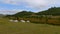 Yurt camp on a beautiful sunny day in Mongolia. Ger campsite in rural country, nature in the background