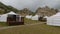 Yurt camp on a beautiful sunny day in Mongolia. Ger campsite in rural country, nature in the background