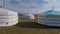 Yurt camp on a beautiful sunny day in Mongolia. Ger campsite in rural country, nature in the background