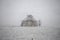 Yurt under the snow in the middle of a snow-covered field. travel Kyrgyzstan