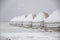 Yurt under the snow in the middle of a snow-covered field. travel Kyrgyzstan