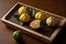 Yuzu fruit from Japan displayed on a wooden tray