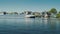 Zaanse Schans, Netherlands, May 2018: A huge barge sails against the background of old houses in Zaans Schans. Transport