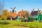 Zaanse Schans village, Holland, green houses against blue sky