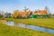 Zaanse Schans village, Holland, green houses against blue sky