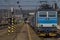 Zabreh station with passenger and cargo trains in sunny day