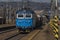 Zabreh station with passenger and cargo trains in sunny day