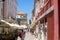 Zadar, Croatia; 07/17/2019: Touristic street with typical colorful croatian buildings in the old town of Zadar, full of