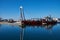 Zadar, Croatia, November 29, 2018. Leverage crane on barge lifting part of concrete pier being demolished and replaced