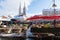 Zagreb, Croatia: January 7 2016: Stand with red parasols at Dolac market during wintertime with snow and cathedral in the backgrou