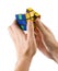 ZAGREB, CROATIA - MARCH 13, 2015: Hands solving Rubiks Cube. Rubiks Cube is invented by Erno Rubik in 1974. He is a Hungarian in