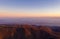 Zagreb Skyline in Croatia. TV Tower Sunset Light Colorful Sky in Background. View from the top of Medvednica Mountain.  Haze