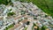 Zahara de la Sierra, Andalusia. Aerial view of whitewashed houses sporting rust-tiled roofs and wrought-iron window bars