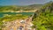 Zahara de la Sierra, Andalusia. Aerial view of whitewashed houses sporting rust-tiled roofs and wrought-iron window bars