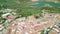 Zahara de la Sierra, Andalusia. Aerial view of whitewashed houses sporting rust-tiled roofs and wrought-iron window bars