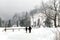 Zakopane, Dolina Koscieliska, Poland - February 7, 2017: Prople walking in the National park with beautiful winter nature.