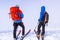 Zakopane, Tatra mountains, Poland - December 16, 2019 Two mountain skiers travelers with large backpacks are preparing to move