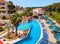 ZAKYNTHOS ISLAND GREECE, JUNE 06, 2016: View on hotel swimming pool bar restaurant, tourists, guests, aqua water park from water s