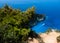 Zakynthos Island, Greece. View on boats, rocky shore and turquoise, crystal clear waters of Ionian Sea