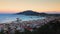 Zakynthos panorama at sunset. Zante town cliff with ferry harbour in the back.