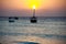 Zanzibar island traditional boat in the ocean at sunset