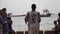 ZANZIBAR, STONE TOWN - JANUARY 2020: Every Day High Tide Zanzibar Routine - Black African Boys Jumping in the Ocean