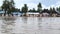 ZANZIBAR, TANZANIA - JANUARY 2020: Villagers playing Soccer Near Big Paddle After Rain in Basic Environment on the