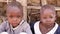 Zanzibar, Tanzania - July 15, 2019: African child of zanzibar, tanzania with his head shaved looking upward, big serious