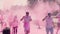 Zaporizhzhia, Ukraine - April 29, 2018: The organizers throw, throw paint holi, pink, color, in the face of the marathon