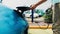 ZAPOROZHYE, UKRAINE - JULY 30, 2016: Man getting ready to charge his electric car