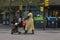 Zaragoza, Spain - August 18, 2020: A black inmigrant woman pushes a stroller