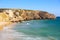 Zavial beach in Portugal with lot of surfers in ocean