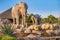 Zebra, elephant and crocodile statues on an artificial fountain and waterfall in the central safari