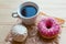 Zefir, donut and coffee cup on crumpled paper