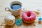 Zefir, donut and coffee cup on crumpled paper