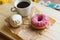 Zefir, donut and coffee cup on crumpled paper