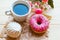 Zefir, donut and coffee cup on crumpled paper