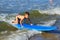 ZELENOGRADSK, KALININGRAD REGION, RUSSIA - JULY 29, 2017: Unknown boy on surfboard resting and learning of surfing.