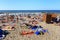 ZELENOGRADSK, KALININGRAD REGION, RUSSIA - JULY 29, 2017: Unknown people resting on a sandy beach on the Baltic Sea coast.