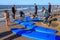 ZELENOGRADSK, KALININGRAD REGION, RUSSIA - JULY 29, 2017: Unknown surfers with surfboards standing on a sandy beach.