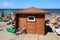 ZELENOGRADSK, KALININGRAD REGION, RUSSIA - JULY 29, 2017: Wooden dressing-room on a sandy beach on the Baltic Sea coast.