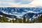 Zell am See at Zeller lake in winter. View from the Mountain Schmittenhohe, snowy slope of ski resort in the Alps