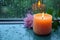 Zen ambiance aroma candle near window with raindrops in monsoon