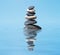 Zen balanced stones stack in lake balance peace silence concept