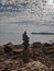 Zen.  A big pyramid of small stones on the seashore at Adriatic seaside in Piran. Meditation, balance, pray concept. tranquil