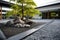 zen garden in the courtyard of a sleek, modern monastery