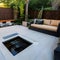 Zen Garden Patio: A tranquil outdoor patio with a Zen garden, a cascading water feature, and cozy seating, providing a peaceful