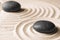 Zen garden stones on sand with pattern