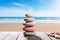 Zen inspired arrangement pebble stack on wood by the beachs serenity